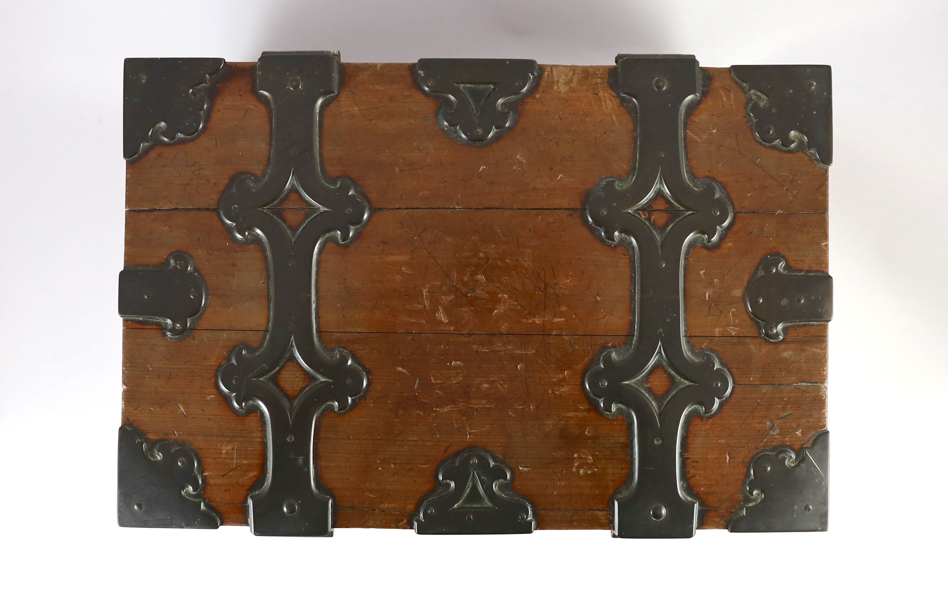 A mid 19th century brass bound stained pine North German Armada chest, with strapwork banding and brass loop handles, width 46cm depth 30cm height 23cm
